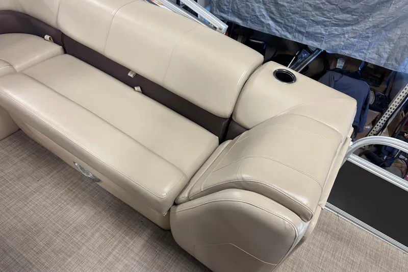Slide: The Image of Beige seating on 2019 Sun Tracker Fishin' Barge 22 XP3 with cup holder. - 12