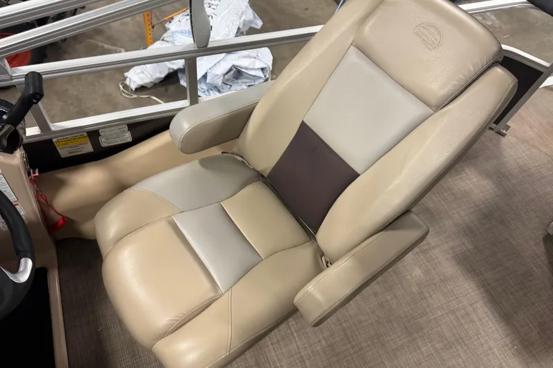 Slide: The Image of 2019 Sun Tracker Fishin' Barge 22 XP3 captain's chair, beige and gray upholstery. - 13