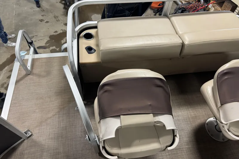 Slide: The Image of 2019 Sun Tracker Fishin' Barge 22 XP3 interior with seating and cup holders. - 18