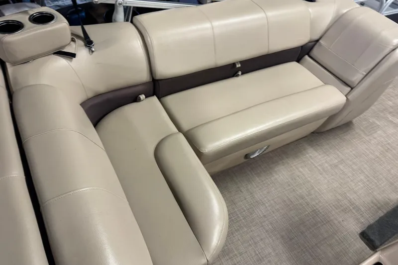 Slide: The Image of 2019 Sun Tracker Fishin' Barge 22 XP3 beige seating with cup holders and storage. - 19