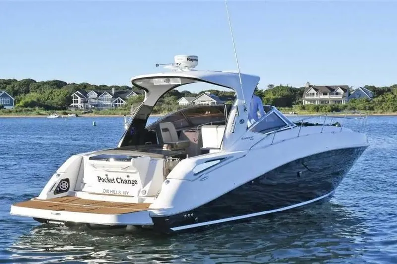 The Image of 2016 Searay Sundancer 370 Gen 3 yacht on serene water near coastal homes. - 0