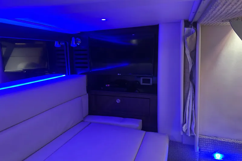 Slide: The Image of Interior of 2016 Sea Ray Sundancer 370 yacht with blue lighting. - 11