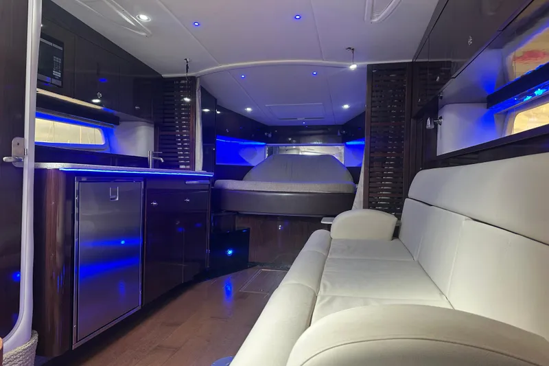 Slide: The Image of Luxurious interior of 2016 Searay Sundancer 370 yacht with modern lighting and furnishings. - 12