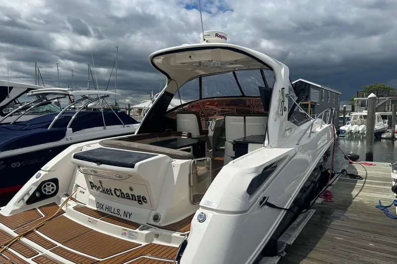 Slide: The Image of 2016 Searay Sundancer 370 docked at marina under cloudy sky. - 3