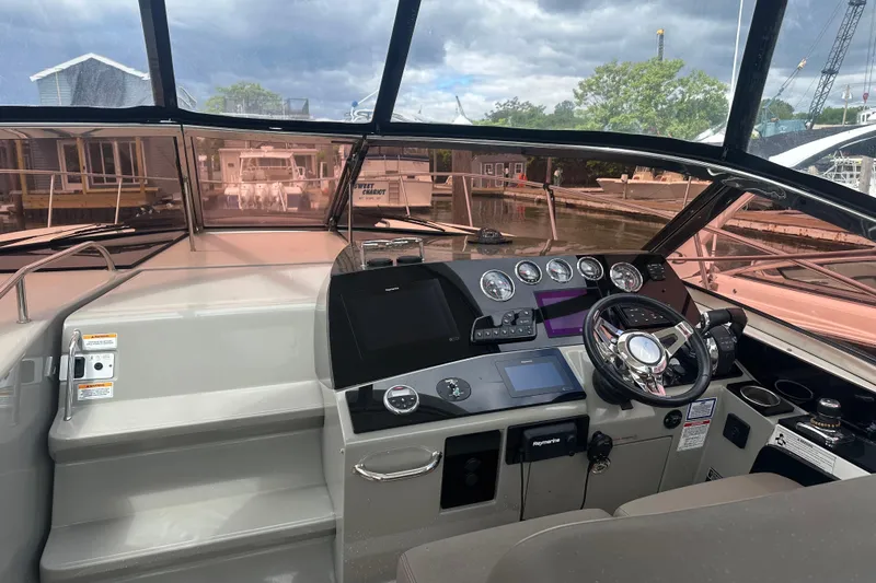 Slide: The Image of 2016 Searay Sundancer 370 helm with modern controls and navigation equipment. - 7