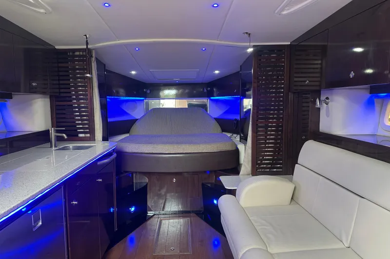 Slide: The Image of Luxurious interior of 2016 Searay Sundancer 370 yacht with modern amenities and ambient lighting. - 9