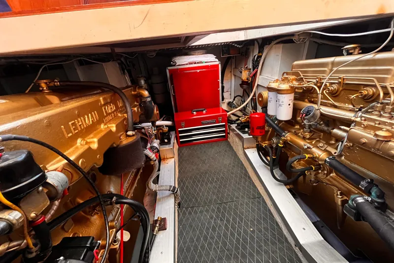 Slide: The Image of Engine room of 1979 Grand Banks 36 Classic with twin Lehman engines and red tool chest. - 14