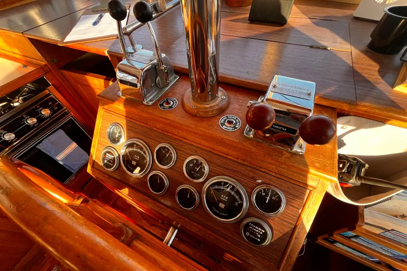 Slide: The Image of 1979 Grand Banks 36 Classic helm with vintage controls and gauges in warm wood finish. - 19