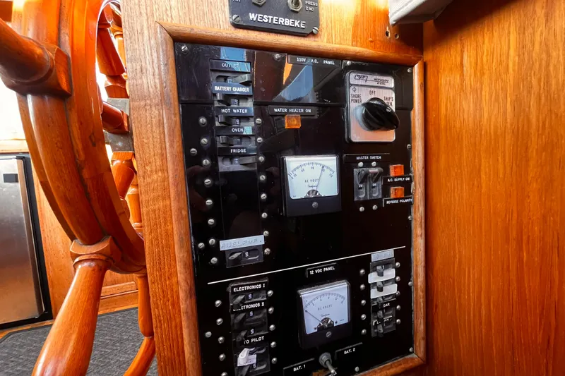 Slide: The Image of Electrical panel and wooden helm of a 1979 Grand Banks 36 Classic boat. - 20