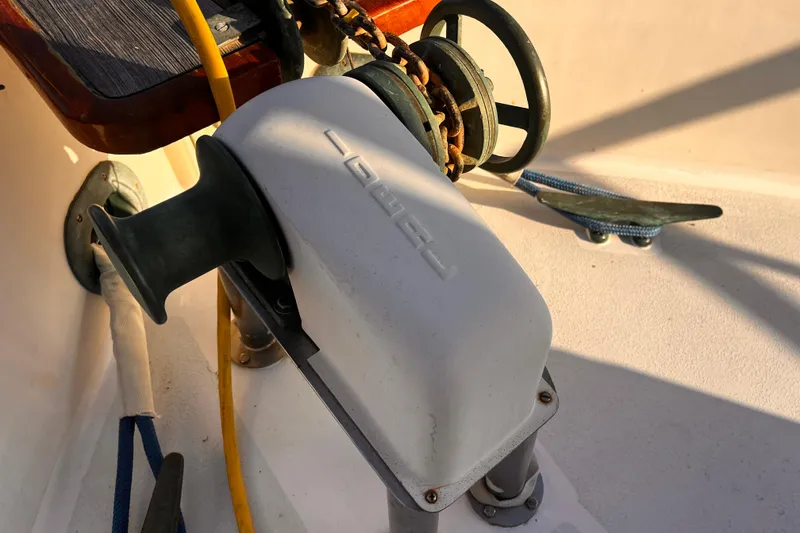 Slide: The Image of 1979 Grand Banks 36 Classic boat winch and anchor chain detail. - 21