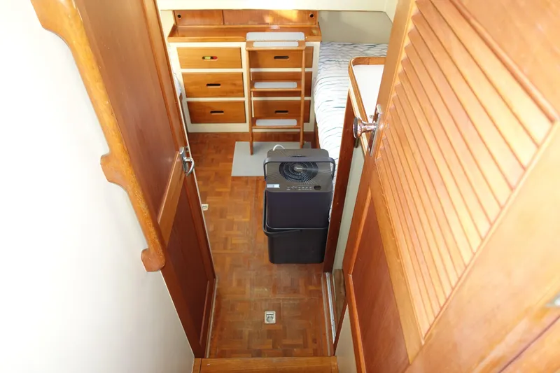 Slide: The Image of Interior of 1979 Grand Banks 36 Classic boat with wooden cabinetry and parquet flooring. - 44