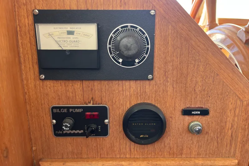 Slide: The Image of Control panel of a 1979 Grand Banks 36 Classic boat with bilge pump and horn. - 58