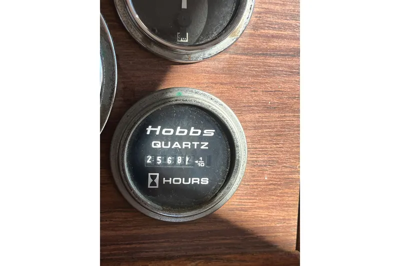 Slide: The Image of Hobbs quartz hour meter on 1979 Grand Banks 36 Classic boat dashboard. - 62