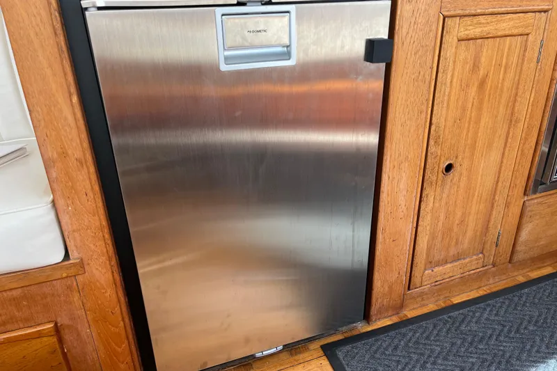 Slide: The Image of Stainless steel fridge in 1979 Grand Banks 36 Classic boat interior. - 65