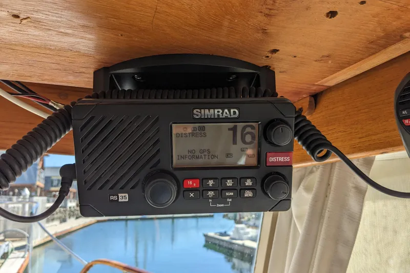 Slide: The Image of Simrad RS35 marine radio on 1979 Grand Banks 36 Classic, displaying distress signal. - 71