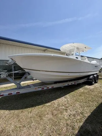 The Image of 2026 Regulator 28 boat on trailer outdoors. - 1