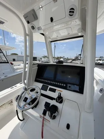 Slide: The Image of Interior view of 2026 Regulator 28 boat with modern helm console. - 3