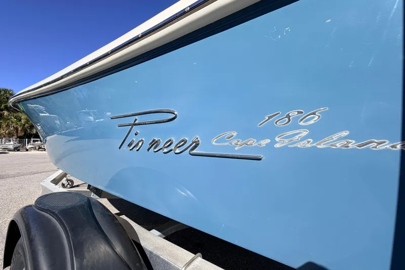 Slide: The Image of 2015 Pioneer 186 Cape Island boat in blue on trailer, side view. - 13