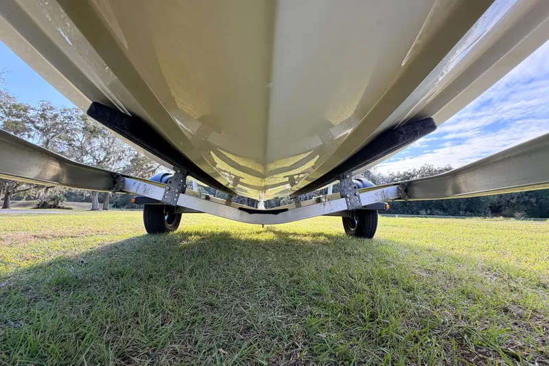 Slide: The Image of Underneath view of a 2015 Pioneer 186 Cape Island boat on a trailer. - 15