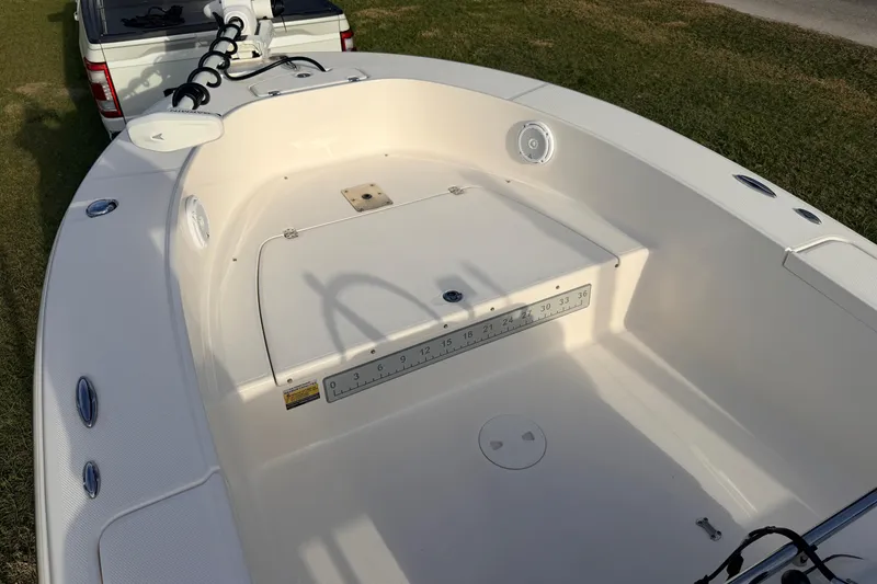 Slide: The Image of 2015 Pioneer 186 Cape Island boat interior with fishing ruler and trolling motor. - 18