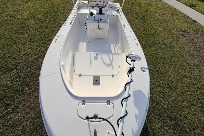 Slide: The Image of 2015 Pioneer 186 Cape Island boat on grass, featuring a Garmin trolling motor. - 25