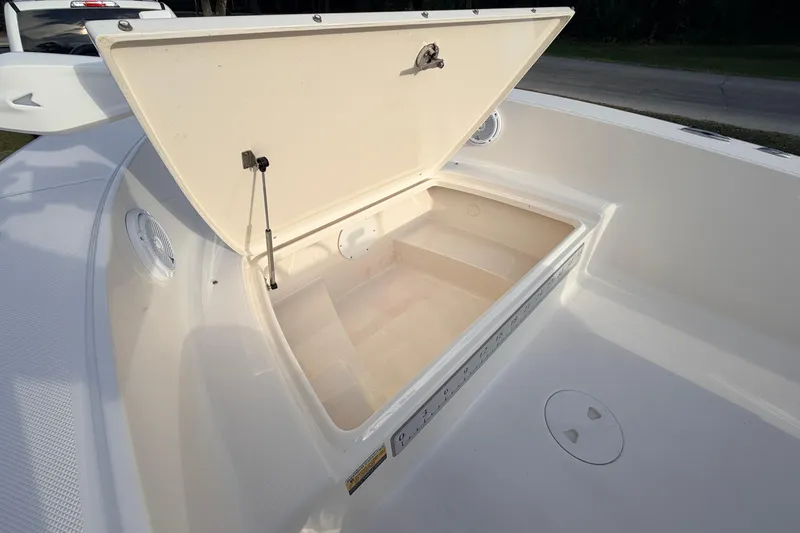 Slide: The Image of Open storage compartment on 2015 Pioneer 186 Cape Island boat deck. - 27