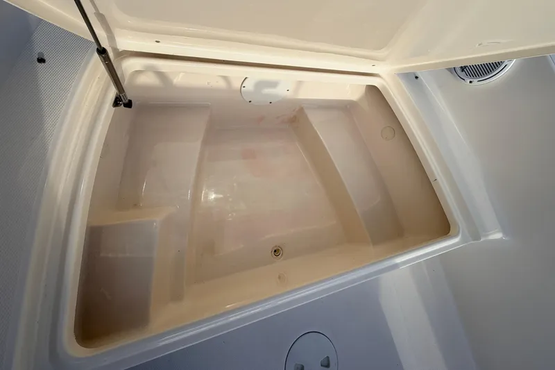 Slide: The Image of Open storage compartment in 2015 Pioneer 186 Cape Island boat. - 28