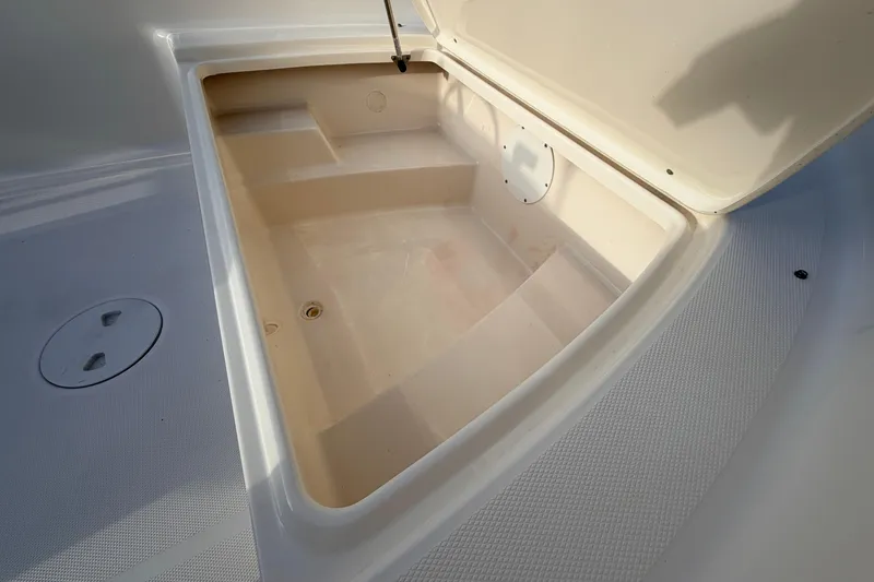 Slide: The Image of Open storage compartment on 2015 Pioneer 186 Cape Island boat, showcasing interior space. - 29