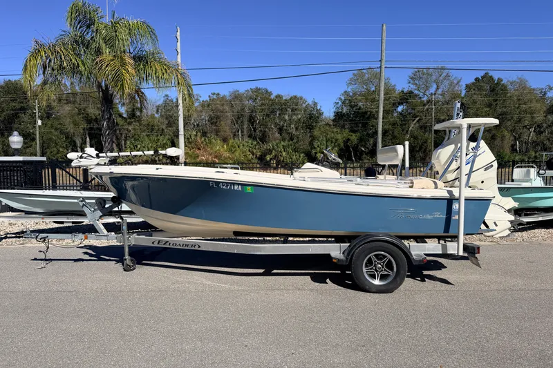 Slide: The Image of 2015 Pioneer 186 Cape Island boat on trailer, parked outdoors. - 3