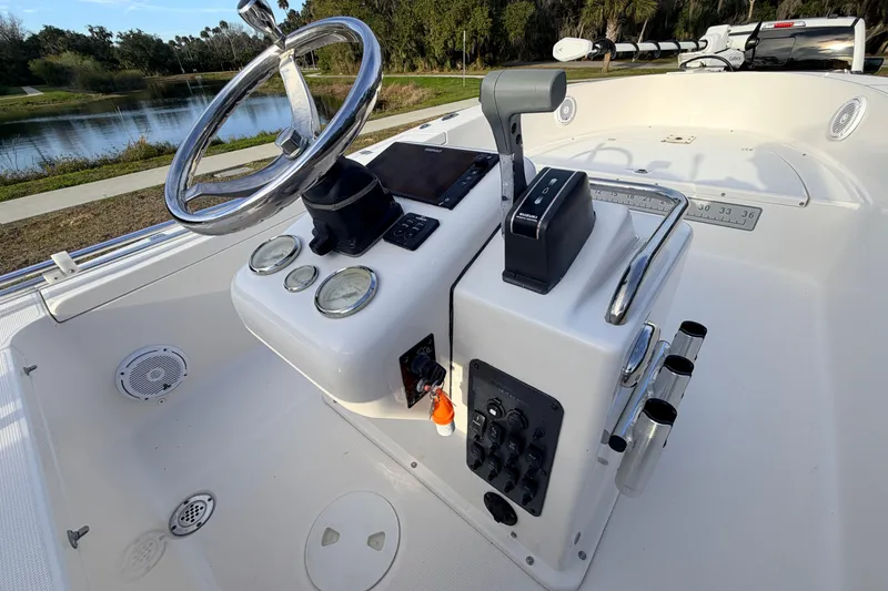Slide: The Image of 2015 Pioneer 186 Cape Island boat console with steering wheel and controls. - 35