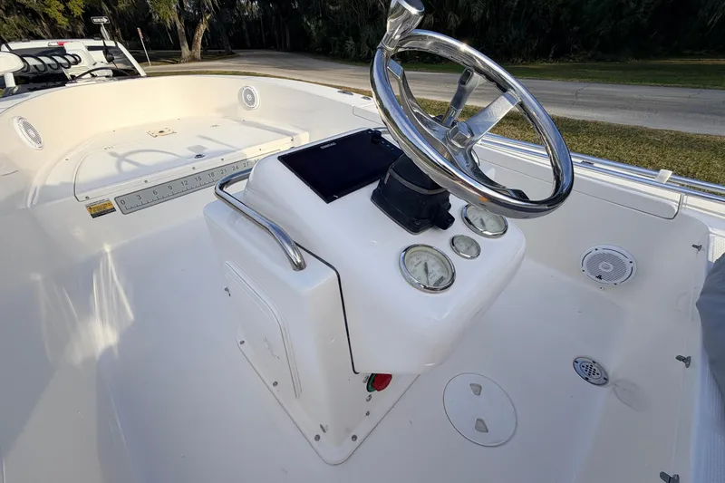 Slide: The Image of 2015 Pioneer 186 Cape Island boat console with steering wheel and gauges. - 38