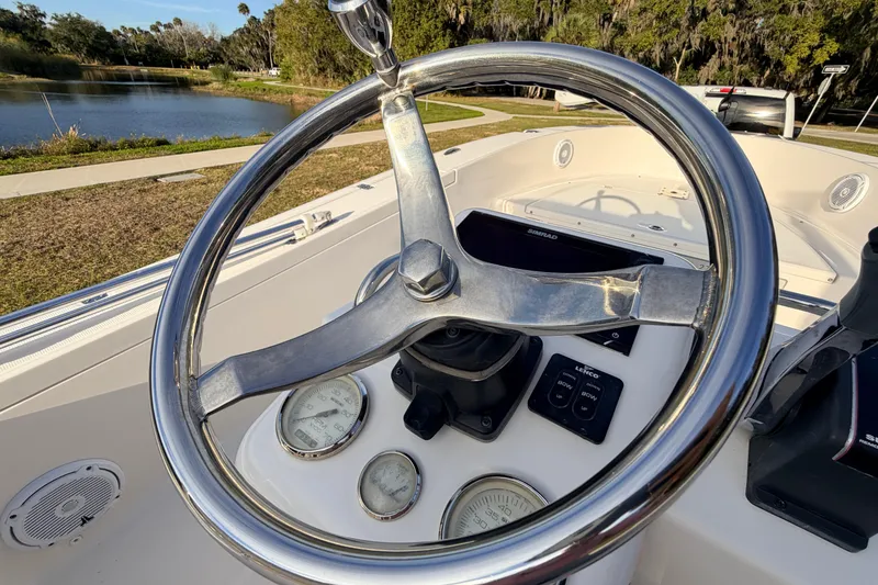 Slide: The Image of Steering wheel of 2015 Pioneer 186 Cape Island boat with dashboard controls. - 40
