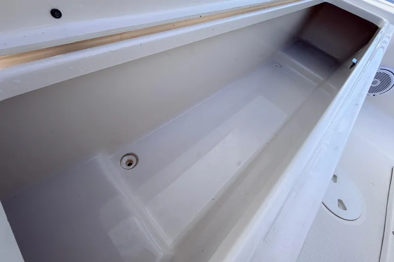 Slide: The Image of Storage compartment of 2015 Pioneer 186 Cape Island boat, featuring a clean, spacious interior. - 43