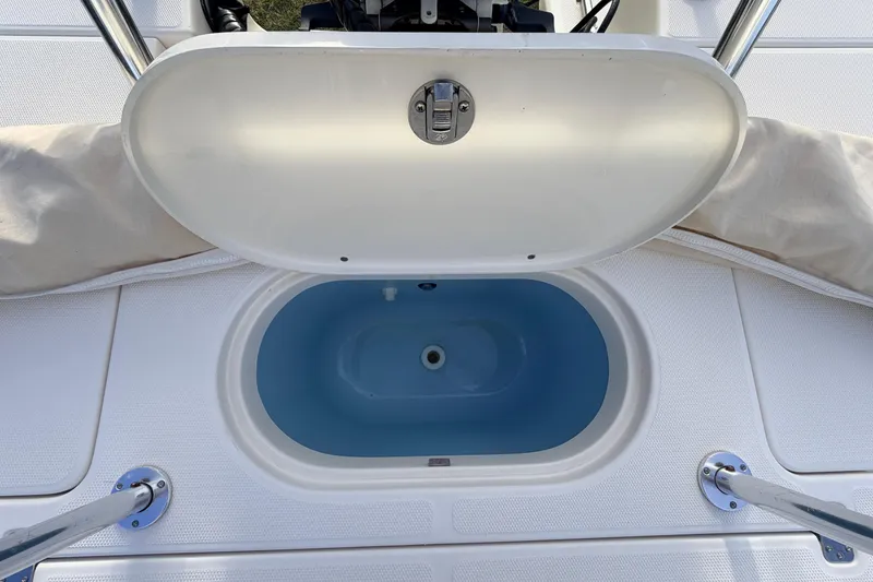Slide: The Image of 2015 Pioneer 186 Cape Island boat with open storage compartment. - 46