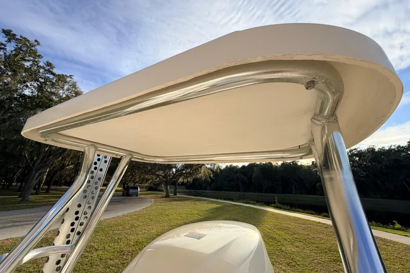 Slide: The Image of 2015 Pioneer 186 Cape Island boat T-top structure under blue sky. - 53