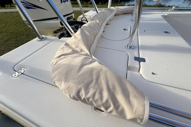 Slide: The Image of 2015 Pioneer 186 Cape Island boat deck with protective cover and stainless steel railings. - 57