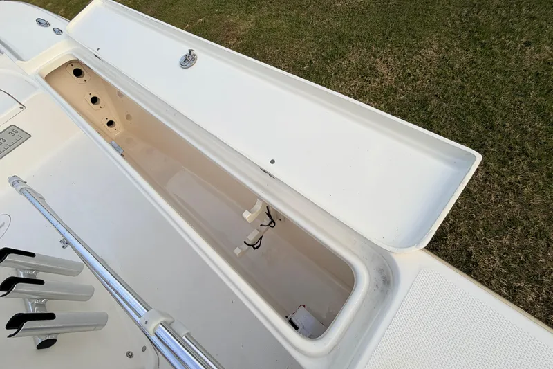 Slide: The Image of Open storage compartment on a 2015 Pioneer 186 Cape Island boat, showing interior details. - 61