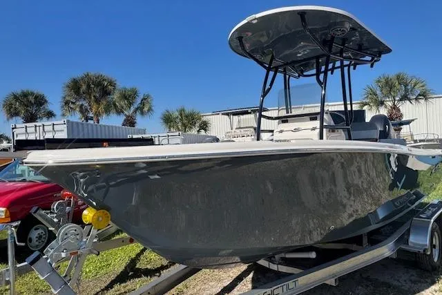 The Image of 2026 Sea Chaser 22 HFC boat on trailer, palm trees in background. - 1