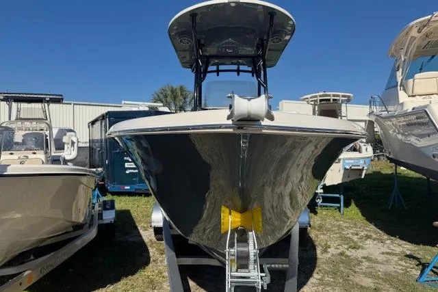 Slide: The Image of 2026 Sea Chaser 22 HFC boat on trailer, displayed outdoors under clear blue sky. - 8
