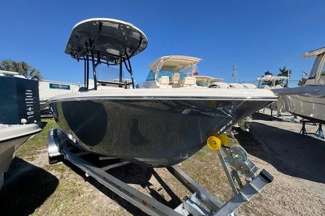 Slide: The Image of 2026 Sea Chaser 22 HFC boat on trailer under clear blue sky. - 9