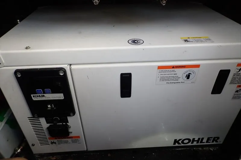 Slide: The Image of Kohler generator in a 1998 Wellcraft 3600 Martinique boat, featuring control panel and safety warnings. - 17