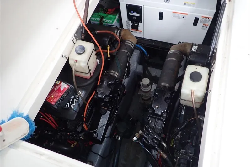 Slide: The Image of Engine compartment of a 1998 Wellcraft 3600 Martinique boat, showing mechanical components. - 18