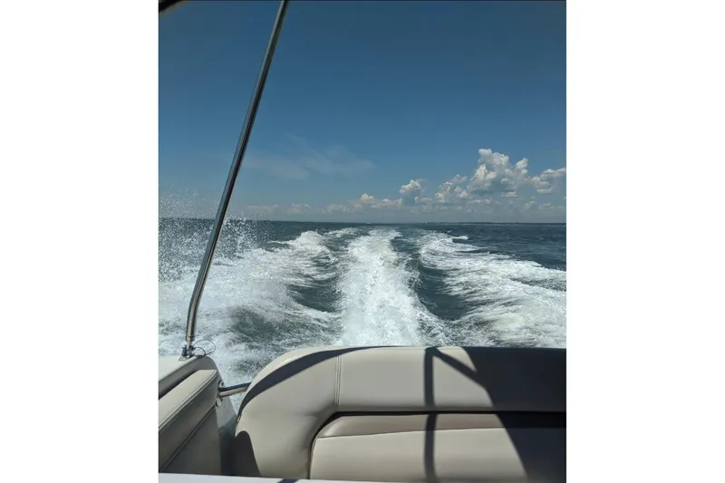 Slide: The Image of Wake behind a 1998 Wellcraft 3600 Martinique boat on a sunny day. - 19