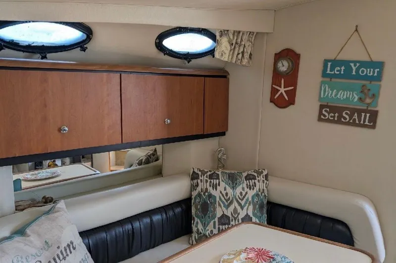 Slide: The Image of Interior of 1998 Wellcraft 3600 Martinique boat with cozy seating and nautical decor. - 8