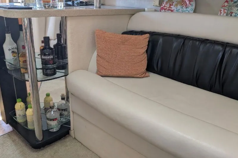 Slide: The Image of Interior of 1998 Wellcraft 3600 Martinique with bar and leather seating. - 9