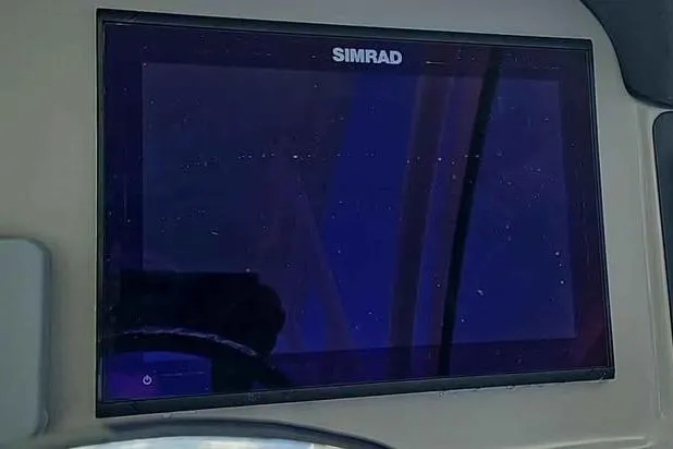 Slide: The Image of Simrad display on 2019 Robalo R247 Dual Console boat dashboard. - 17