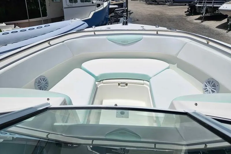 Slide: The Image of 2019 Robalo R247 Dual Console boat with spacious seating and modern design. - 4