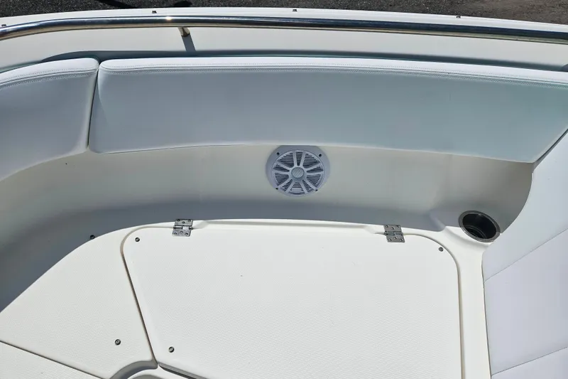 Slide: The Image of 2019 Robalo R247 Dual Console boat interior with seating and speaker. - 42