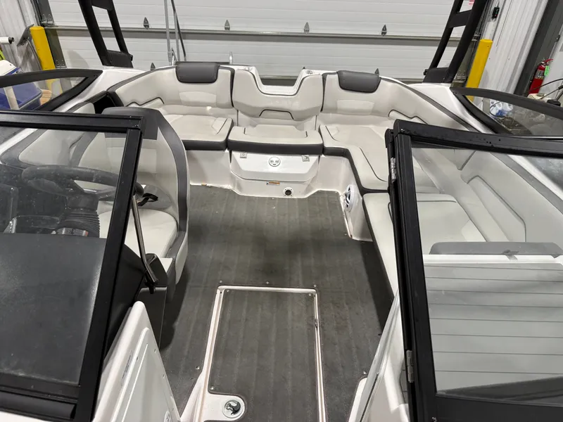 Slide: The Image of Interior of a Yamaha AR190 boat with gray seating and glass windows. - 3