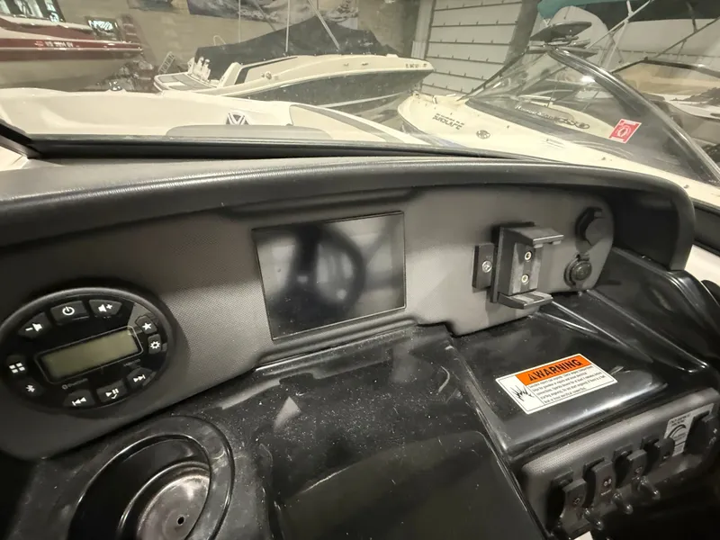 Slide: The Image of The image shows the dashboard of a 2023 Yamaha AR190 boat with various controls. - 11